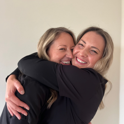village dental centre team hug